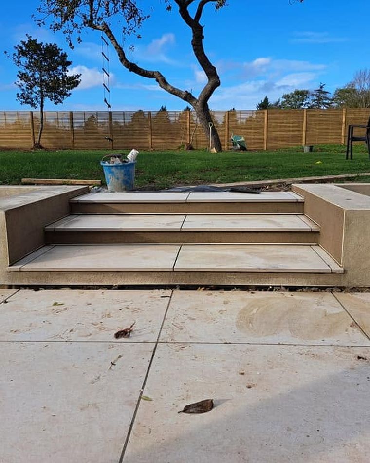 Rendered garden steps and seating wall on a patio